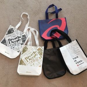 4 Lululemon small bags + 1 ASICS bag